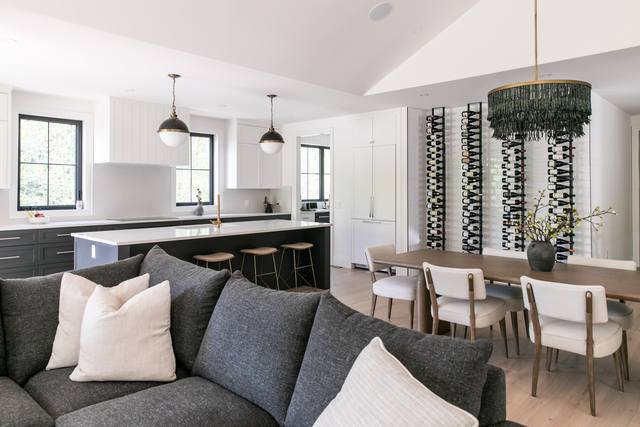 Open living, dining and kitchen space with large windows
